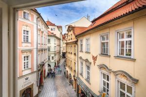 an alley in the old town of prague with buildings at The Dominican in Prague