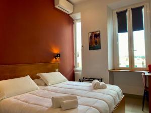 Posteľ alebo postele v izbe v ubytovaní Casa Cecilia