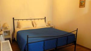 Postel nebo postele na pokoji v ubytování To Portoni Guesthouse
