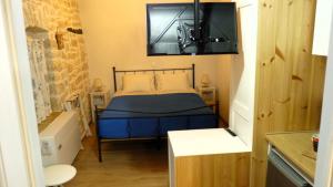 Postel nebo postele na pokoji v ubytování To Portoni Guesthouse