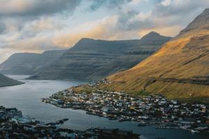 an aerial view of a town in the middle of a mountain at Cozy apartment in Klaksvík