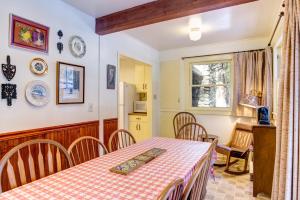 a kitchen and dining room with a table and chairs at Chatterton's Cottage in Wawona