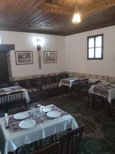 a dining room with tables and couches in a room at Han SAFRANBOLU in Safranbolu +36 photos