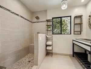 a bathroom with a sink and a shower at Maison on the Beach in Los Angeles +120 photos