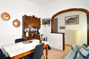 a dining room with a table and chairs at Cà MEA in Re