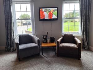 Khu vực ghế ngồi tại Luxury spacious room