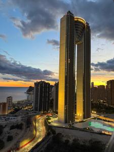 a view of a city with a tall building at Intempo Sea View by Leo Apartments in Benidorm