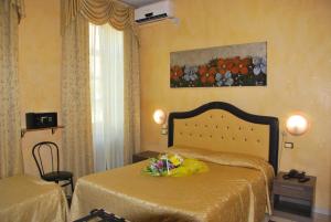 Ένα ή περισσότερα κρεβάτια σε δωμάτιο στο Hotel Antico Distretto