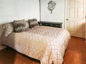 a bedroom with a bed with a comforter at Sq Gretas Place in Sequim +19 photos