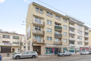 a large building with cars parked in front of it at Zentrale Lage, Spülmaschine, Kingsize Bett, Netflix in Pforzheim
