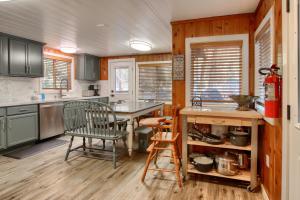 a kitchen with a table and chairs in a room at The Little Creek Cabin in Wawona