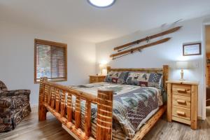 a bedroom with a bed and a couch at The Little Creek Cabin in Wawona