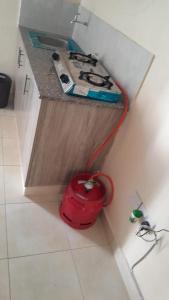 a red fire hydrant on a counter in a kitchen at Gloria's homes in Mtwapa