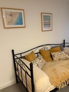 a bed with pillows on it in a room at Miltenberg Moments Ferienwohnung in Miltenberg
