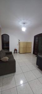 a living room with a couch and a table at Hostel Recanto do Descanso in Guarulhos