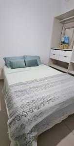 En eller flere senge i et værelse på Aconchego Próximo ao Mar