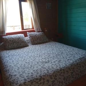 En eller flere senge i et værelse på Cabaña para 4 pax