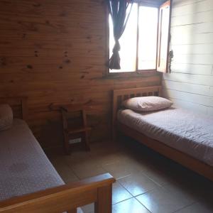 En eller flere senge i et værelse på Cabaña para 4 pax