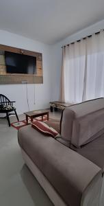 Et opholdsområde på Aconchego Barulho do Mar