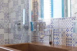 a bathroom with a sink and a mirror at Solmaris Seaside - Luxury B&B sul mare a Campomarino in Maruggio +39 photos