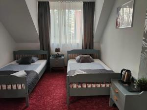 Posteľ alebo postele v izbe v ubytovaní DW Agat