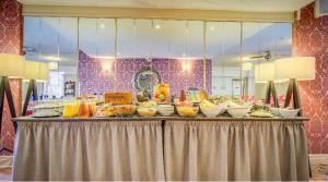 a buffet of food on top of a table at Adelaide House Hotel - Opposite Winter Gardens, Town Centre in Blackpool +26 photos