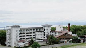 a large white building with a lot of windows at Villa Inawashiro - Vacation STAY 27680v in Inawashiro +9 photos