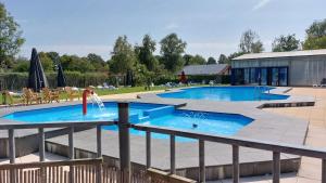 a pool with a water slide in the middle at Gramsbergs Huuske in Gramsbergen