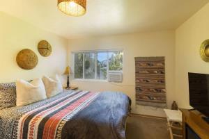 a bedroom with a bed and a window at SQ Rose Bud 1 in Sequim
