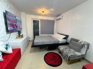 a small room with a bed and a couch at Casa Manawari in Tagaytay +18 photos