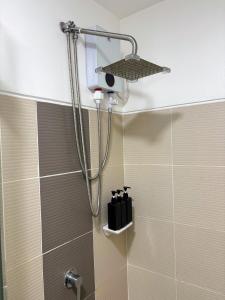 a shower with a shower head in a bathroom at Casa Manawari in Tagaytay