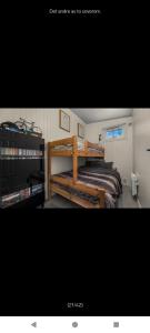 a bedroom with a bed and a book shelf at Ski inn Ski Out Best holiday Apartments i Oppdal in Oppdal