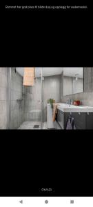 a picture of a bathroom with a sink and a tub at Ski inn Ski Out Best holiday Apartments i Oppdal in Oppdal