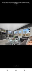 a picture of a living room with a tv at Ski inn Ski Out Best holiday Apartments i Oppdal in Oppdal