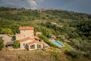 an aerial view of a house with a swimming pool at Villa Olivo by Great Stays in Città della Pieve