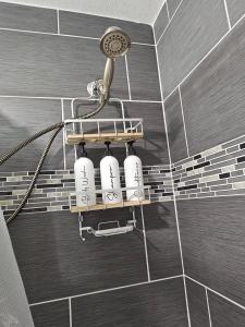 a bathroom with a shower with a blow dryer at Belton Lakehouse in Belton +76 photos