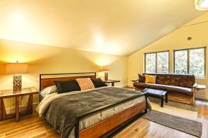 a bedroom with a large bed and a couch at Sqe Mystic Grove in Sequim