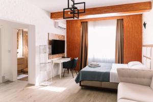TV a/nebo společenská místnost v ubytování Hotel Platinum Lux