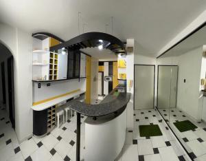 a kitchen with a counter in the middle of a room at Araguaney esplendoroso y agradable in Rabanal