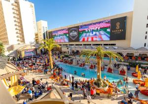 a group of people standing around a pool in a shopping mall at SAHARA Las Vegas in Las Vegas