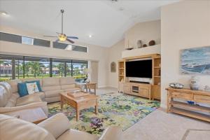 a living room with a couch and a tv at LPC1140 in Punta Gorda