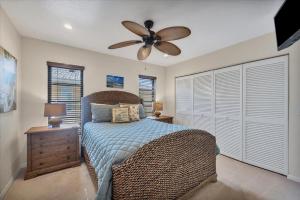 a bedroom with a bed and a ceiling fan at LPC1140 in Punta Gorda +30 photos