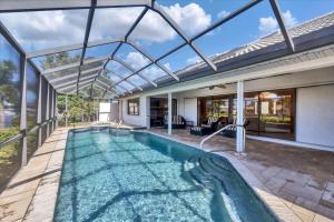 an indoor swimming pool with a glass roof at LPC1140 in Punta Gorda