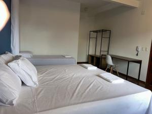 Ένα ή περισσότερα κρεβάτια σε δωμάτιο στο Self-Host Hotel