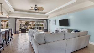 a living room with a couch and a television at NPL829 in Punta Gorda