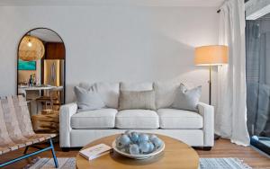 a living room with a couch and a table at Sea La Vie at Sapphire Beach Resort & Marina in East End +63 photos