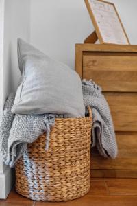 a wicker basket with a pillow on top of it at Sea La Vie at Sapphire Beach Resort & Marina in East End