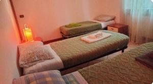 Postel nebo postele na pokoji v ubytování Le Chic 2 Vanzago