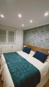 En eller flere senge i et værelse på Apartamento Fana