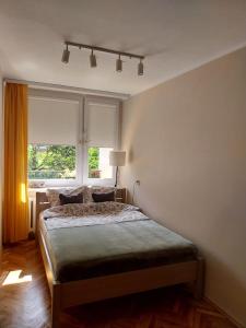 Posteľ alebo postele v izbe v ubytovaní Apartament nad Małym Jeziorakiem